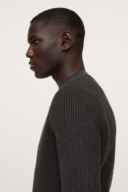 Charcoal crewneck sweater side view, ribbed knit long sleeves