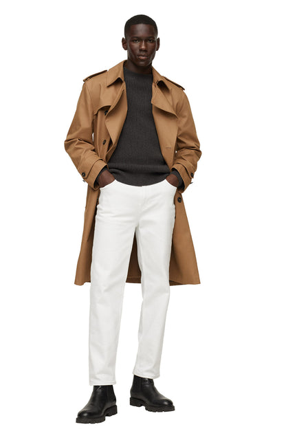 Charcoal ribbed crewneck sweater, long sleeves, layered under a tan coat