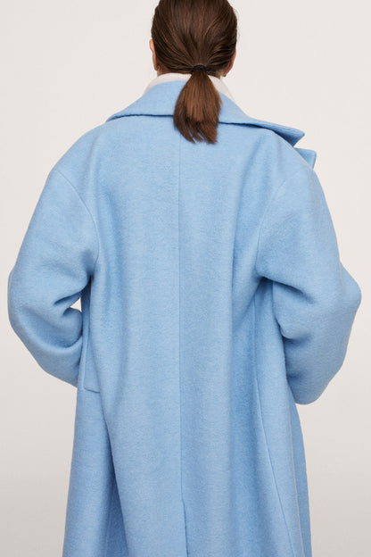 Sky blue long coat with stand collar and button placket, back close-up