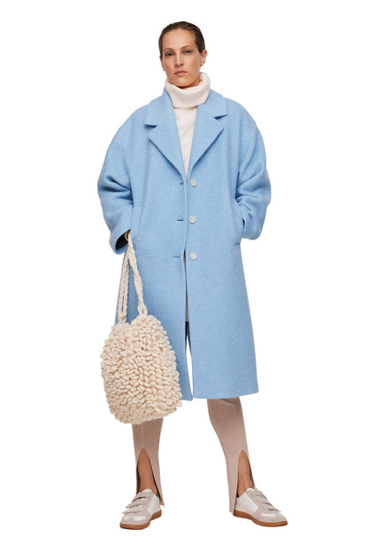 Sky blue long coat with stand collar, button front, and side slant pockets