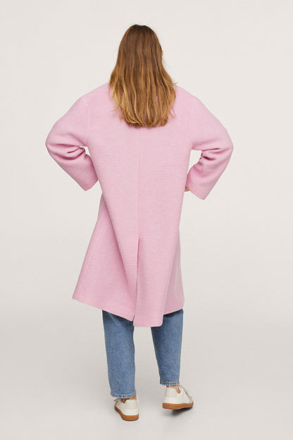Pale pink long coat, back view, with wide lapels and side split hem