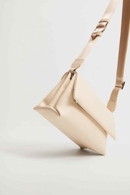 Off-white tote-style shoulder bag with flap and long strap, side view