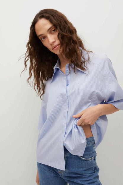 Sky blue striped button-up shirt with short sleeves and collar, front view
