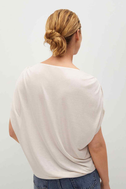 Light grey blouse back view with gathered shoulder detail and short sleeves
