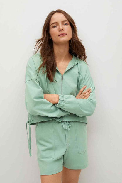Pastel green zip-up hoodie and drawstring shorts set, front view, long sleeves