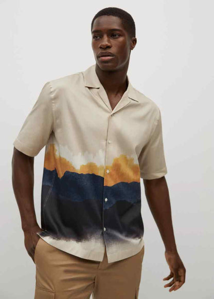MANGO sand short-sleeve button-up shirt front 3/4 view with orange and blue abstract print