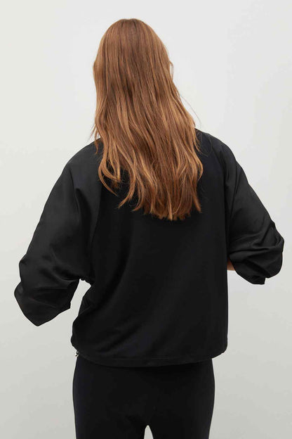 Black hooded jacket, back view, long sleeves