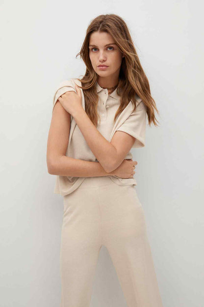 Ecru knit polo with short sleeves and buttons, matching wide-leg culotte pants