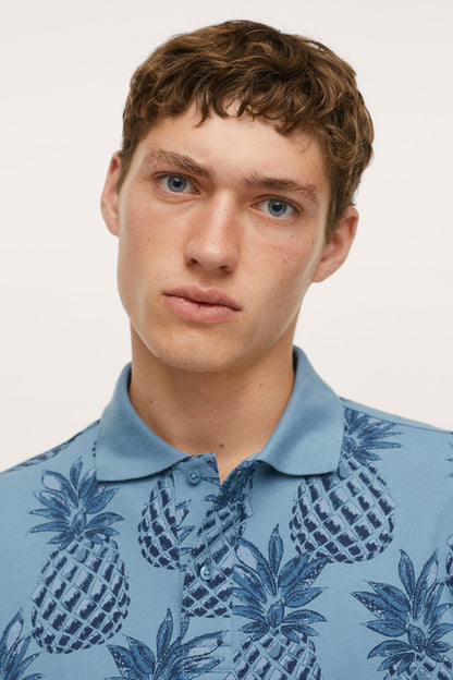 Close-up of blue pineapple-print short-sleeve button-up shirt collar