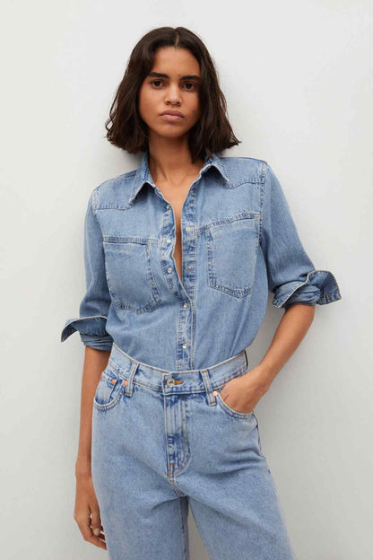Light blue denim shirt with chest pockets and high-waist jeans