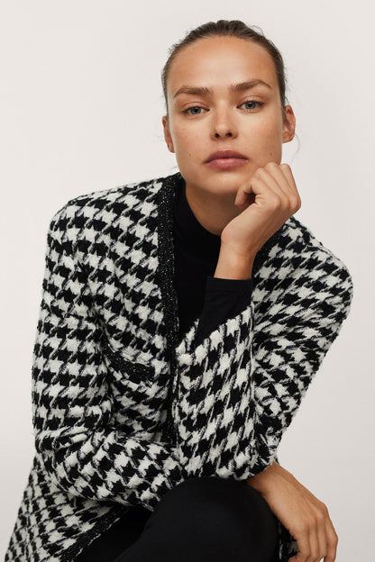 MANGO houndstooth jacket close-up with textured weave and wide lapels
