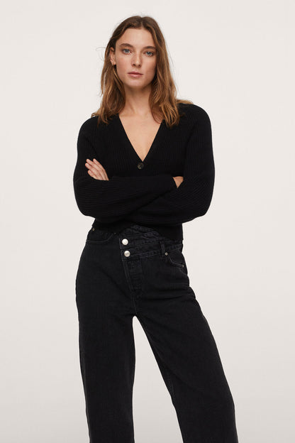 Black denim jeans with button fly, front pockets, and belt loops