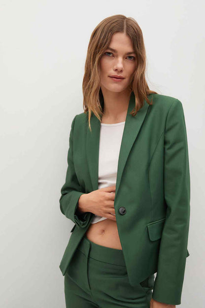 Dark green women's blazer with notched lapels and matching slim trousers, front view
