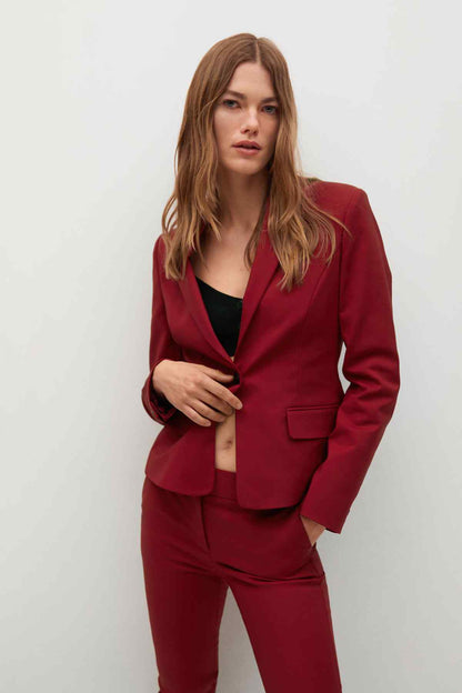 Maroon blazer with welt pocket and open front, worn with matching pants