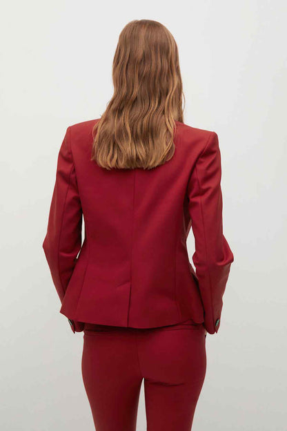 Maroon blazer with fitted back and long sleeves, rear view only
