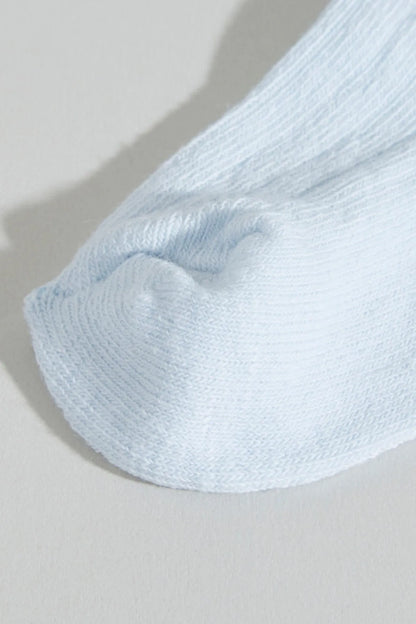 Baby sock, light blue ribbed cuff and knit texture
