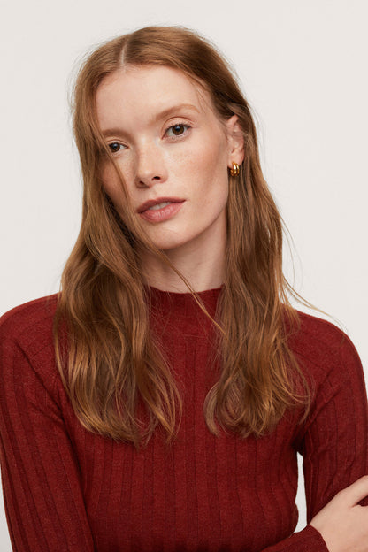 Dark red ribbed knit crew-neck top close-up