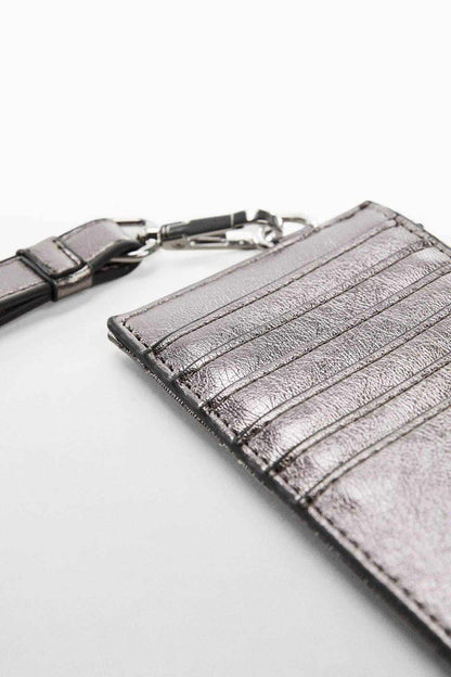 Dark silver metallic crossbody mini bag corner view with zipper and striped texture