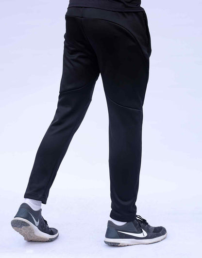 Black jogger pants with back seam curves and cuffed hem