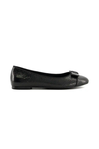Black textured ballet flats with bow buckle strap and low profile sole