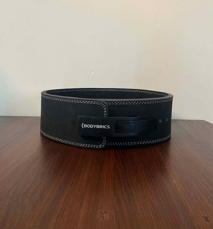 Black lifting belt with Bodybrics logo patch and front buckle