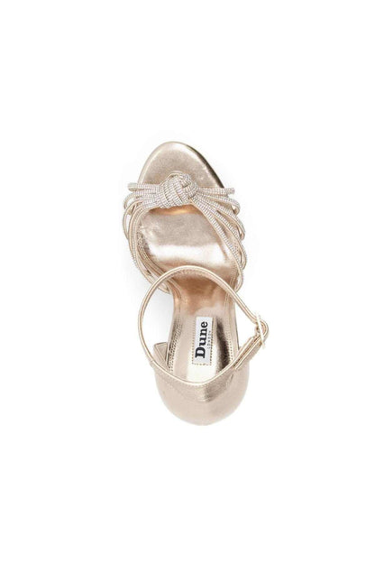 Dune London gold heeled sandals with ankle strap and bow laces, back view