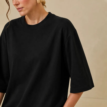 Black crew-neck short-sleeve t-shirt close-up with 3/4-length sleeves