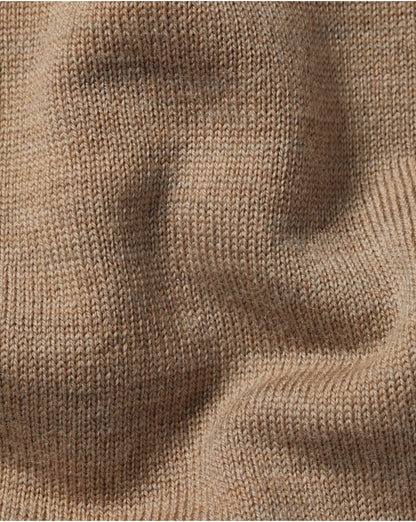 Beige wool knit sweater texture close-up, ribbed pattern
