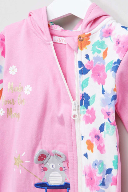 Pink hooded baby jumpsuit close-up: front zipper, floral side panels, animal print