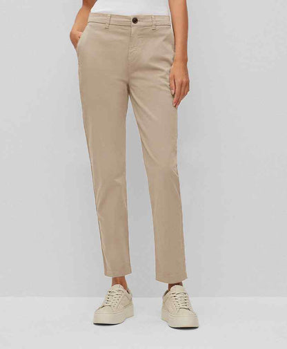 Fitted tan chinos with button closure and slim straight fit, front view