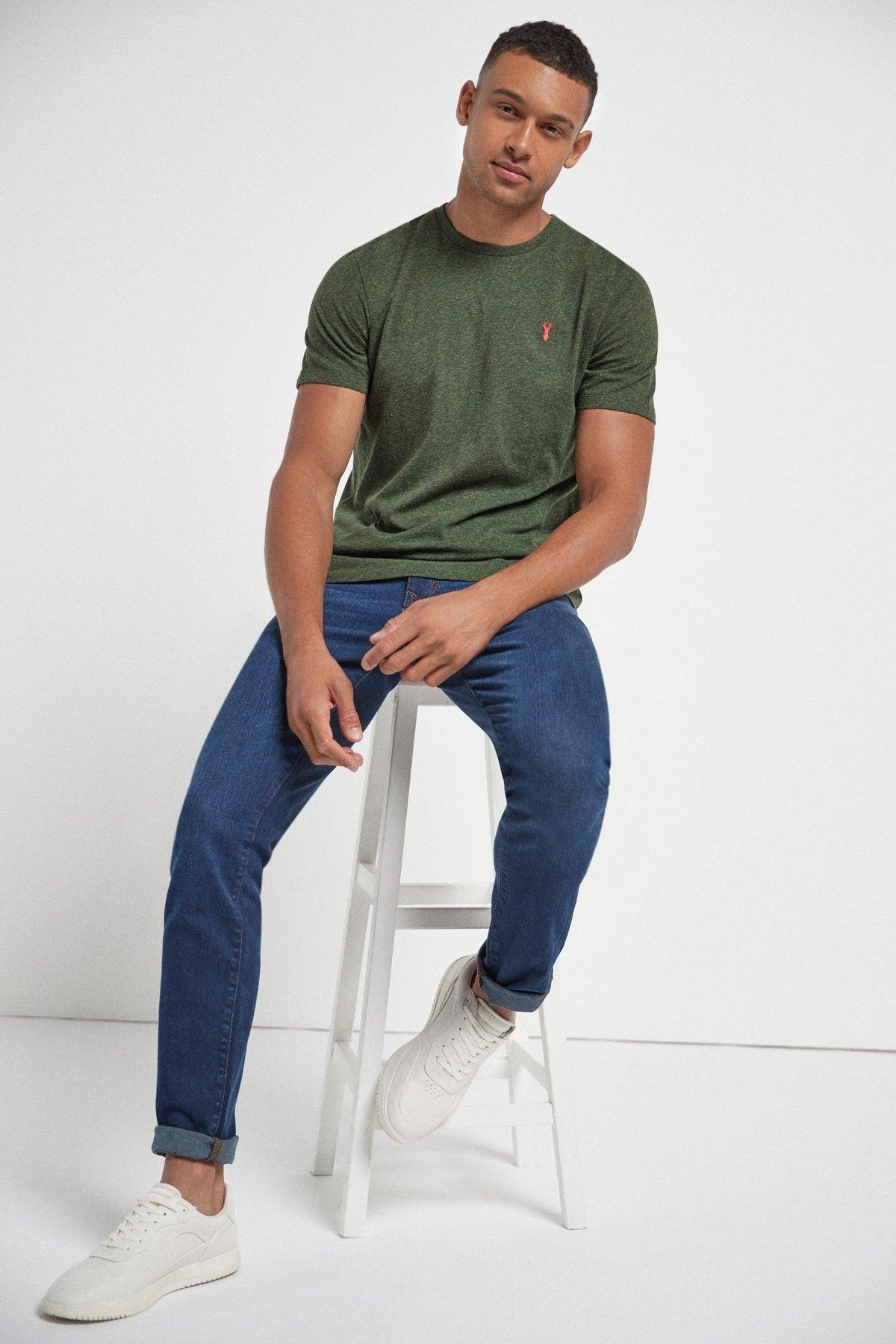 Green short-sleeve T-shirt with small red logo on the chest
