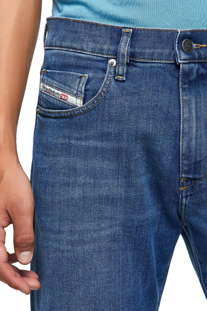 Blue denim jeans close-up of front pocket and button