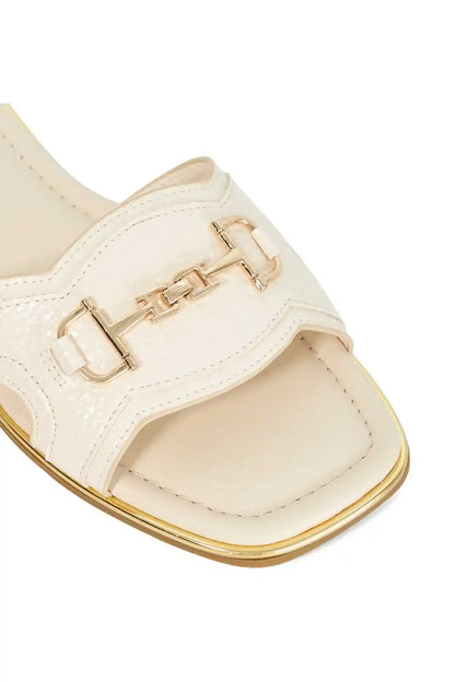 Ecru slide sandal strap with gold buckle hardware and stitched seams