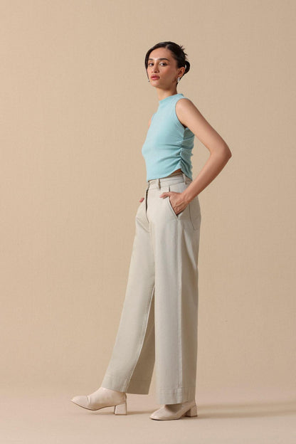 Mint sleeveless crop top with light beige high-waist wide-leg trousers
