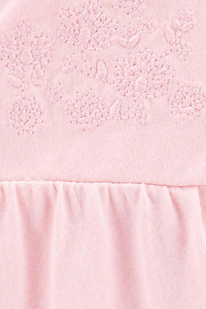 Pink textured bodysuit fabric with embroidered pattern and gathered waist