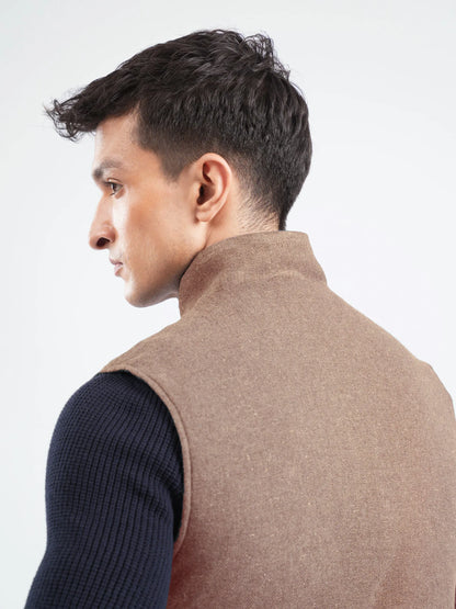 Brumano brown vest back view with high collar, sleeveless knit sleeves visible