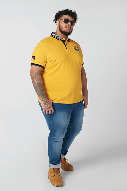 Men's yellow polo shirt with striped collar and black sleeve trim