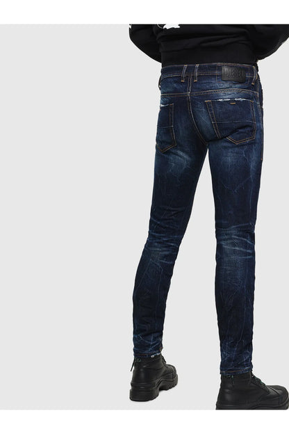 Men's indigo jeans front view with coin pocket, belt loops, and curved yoke