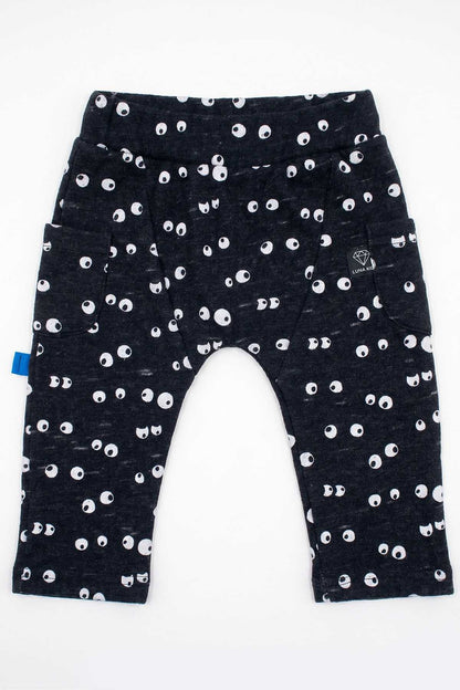 Navy baby pants with white eye print, blue tag, and elastic waist