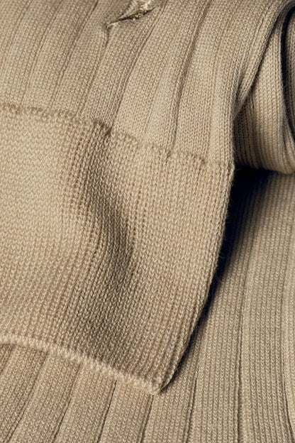 Charles Tyrwhitt beige knit dress socks close-up with ribbed leg and navy heel