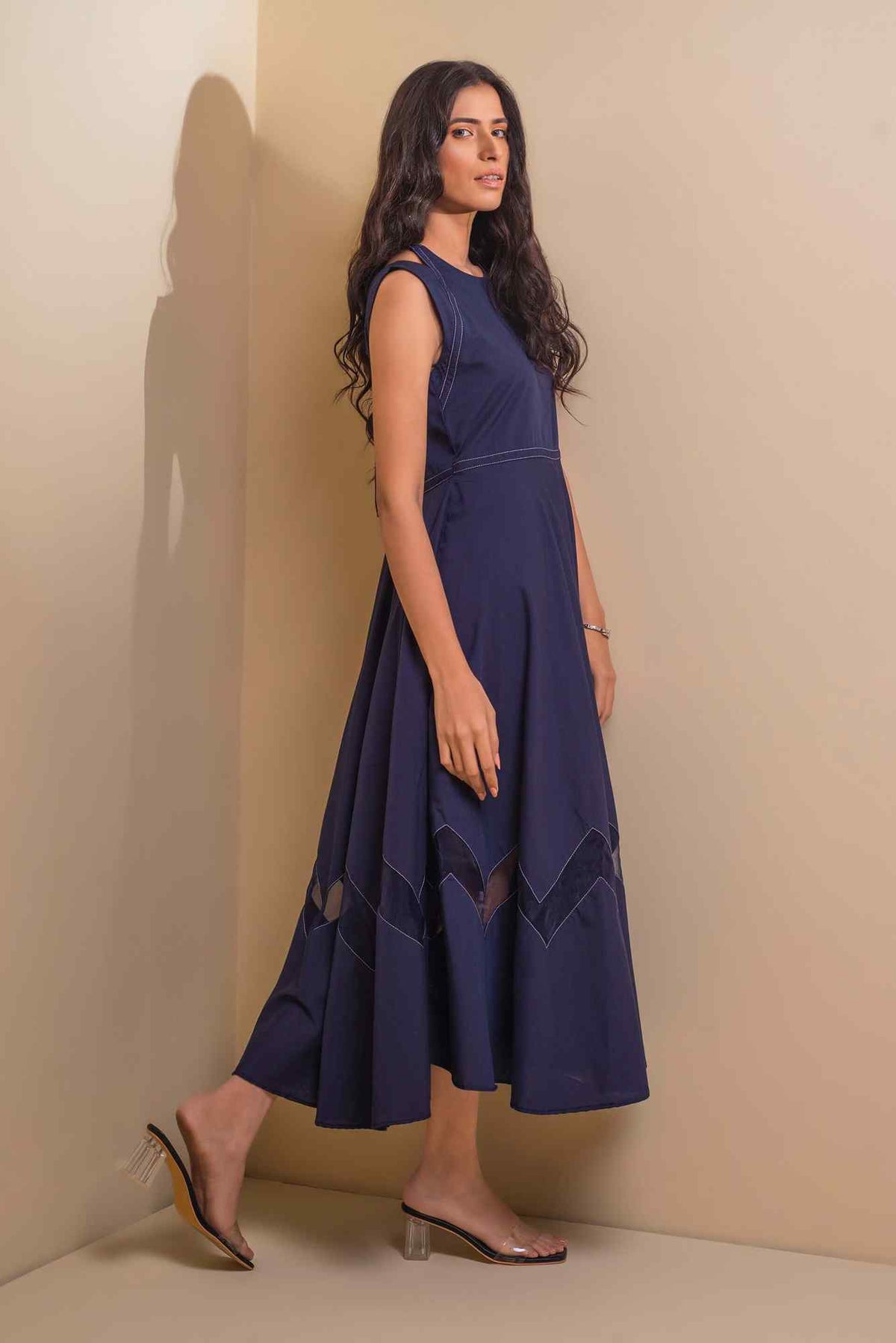 Blue sleeveless velour midi dress with fitted bodice and zigzag hem trim