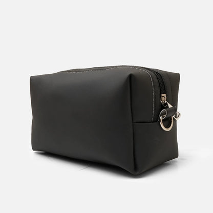 Black padded toiletry bag with side strap and metal D-ring hardware