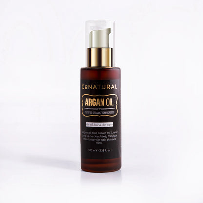 Argan oil bottle with gold spray cap, amber glass