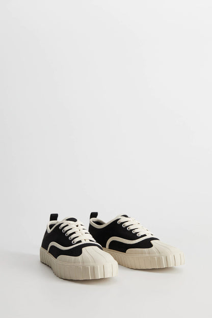 Black and cream lace-up sneakers with chunky platform sole