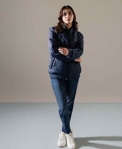 Quilted puffer jacket with zip front, stand collar, and two side pockets
