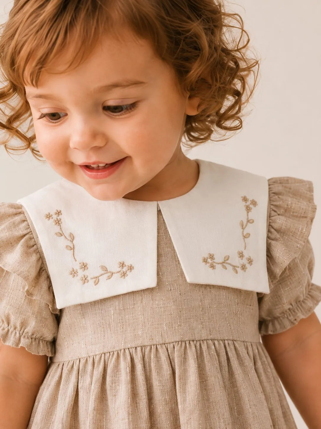 Girls stone dress with white floral embroidered collar and short puff sleeves