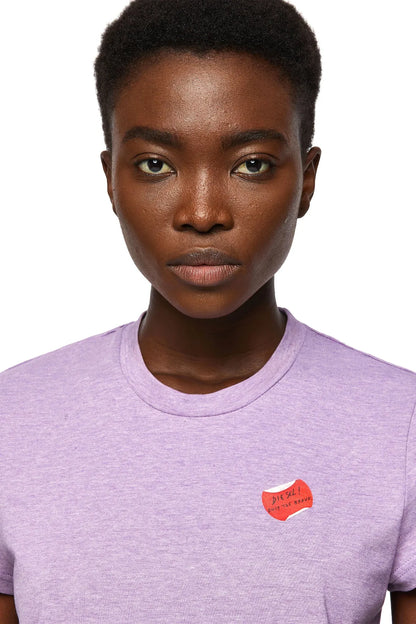Diesel lilac crew-neck T-shirt with red chest logo patch, close-up