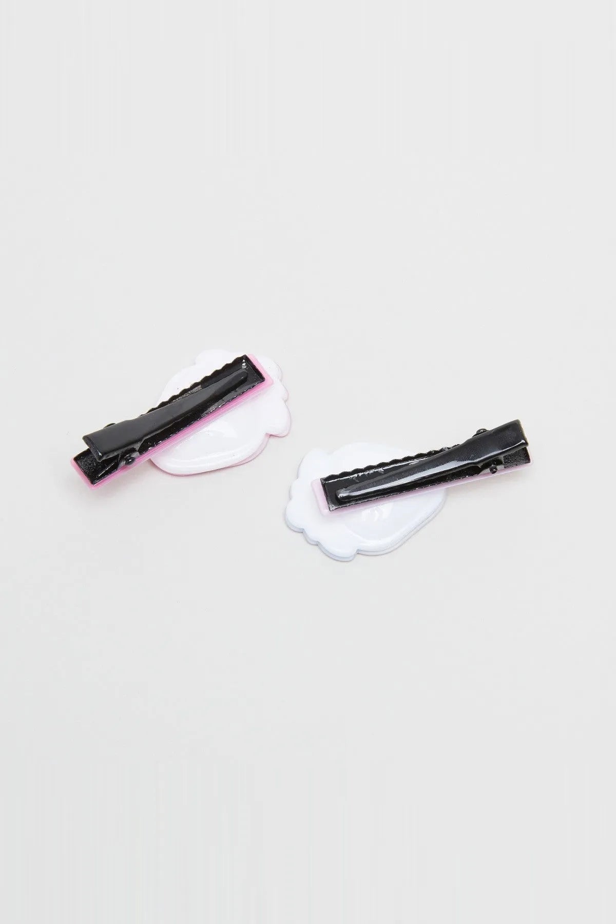 Babyshop black hair clips with white cloud-shaped backing