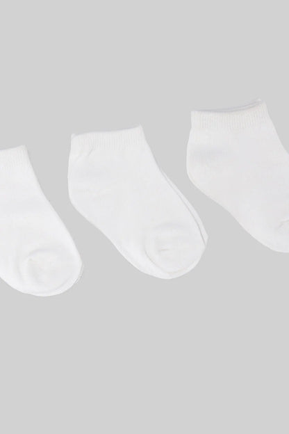 Three white baby socks, ribbed cuffs, smooth knit and rounded toe