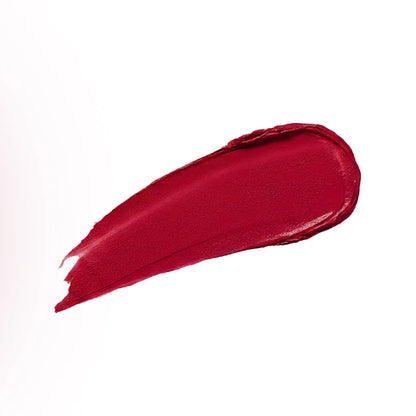 Conatural velvet lipstick swatch, rich red smear on white background